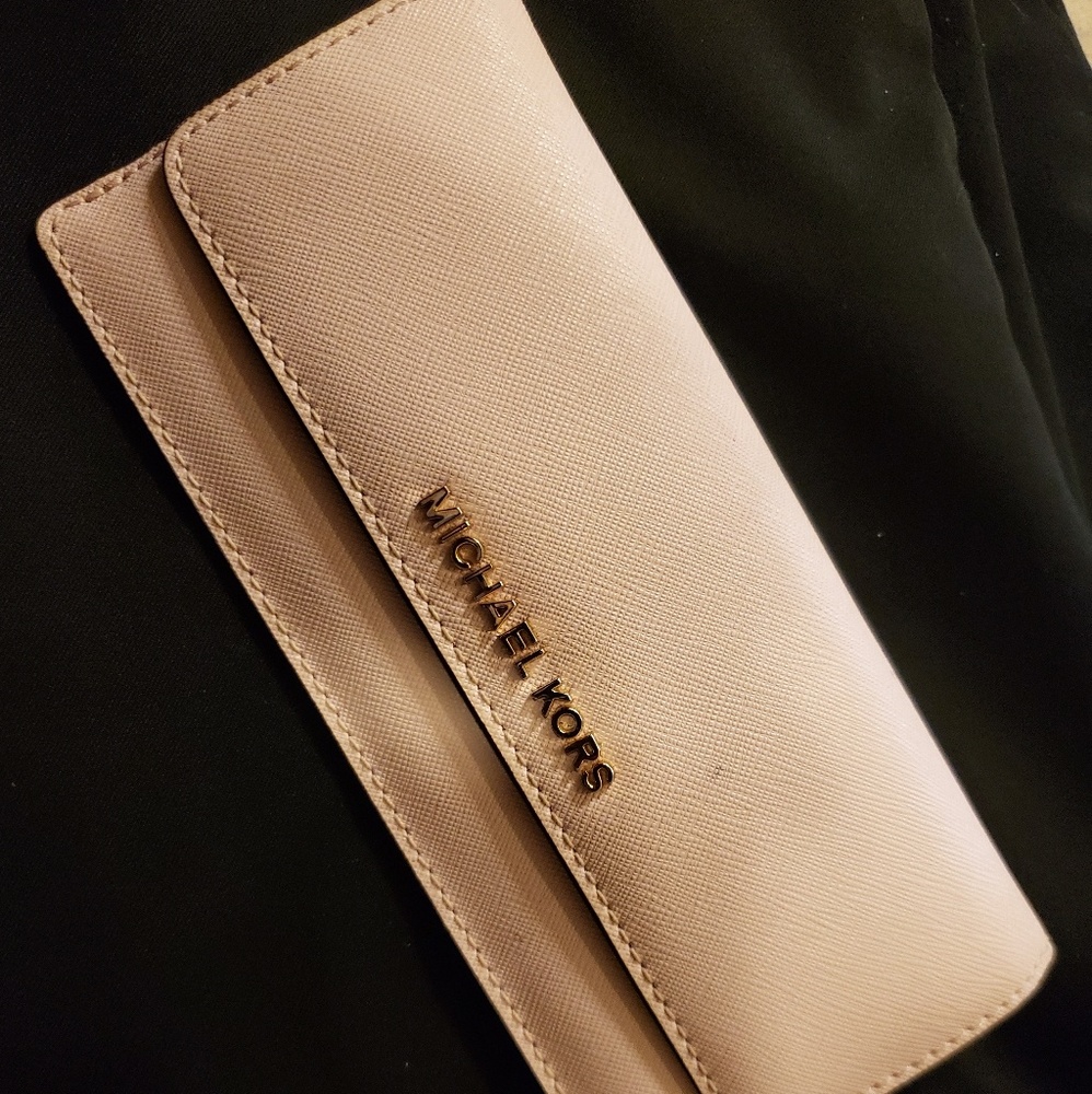 Pink Michael Kors wallet.
